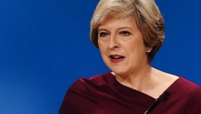May tells EU immigrants: &#039;We want you to stay&#039;